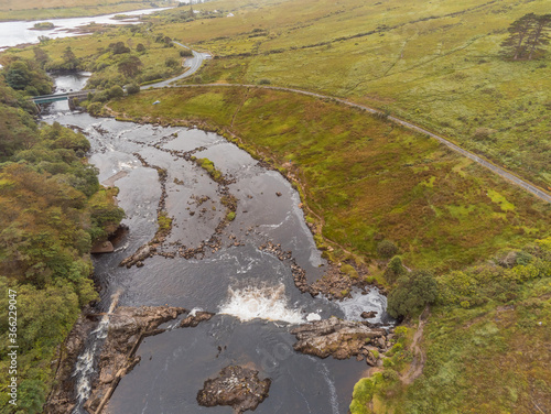 Aerial view on Aasleagh water fall in county Mayo, Ireland. Beautiful Irish landscape, Sun flare. Nobody.