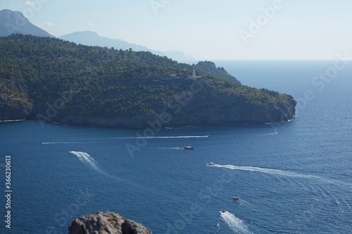 From La Torre Picada, we can see the Cabo Gros Lighthouse located on a promontory at the west entrance to the port of Sóller, on the island of Mallorca, Spain.