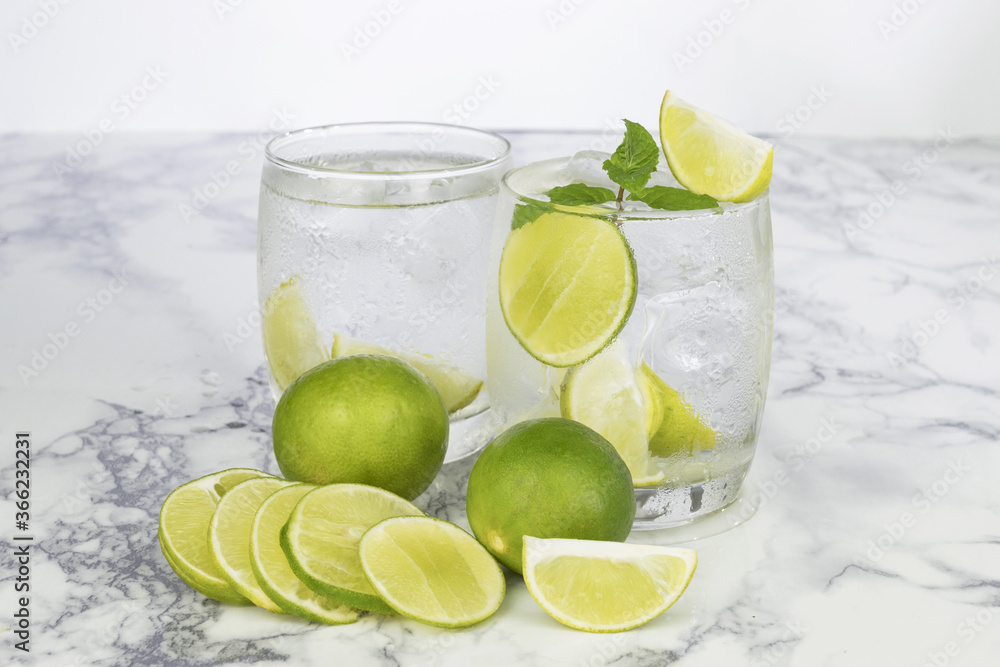 Cold Drink from Lemon cut into pieces in water glass Cold Drink from Lemon cut into pieces in water glass
