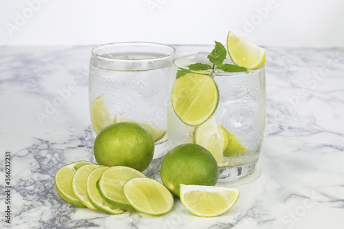 Cold Drink from Lemon cut into pieces in water glass