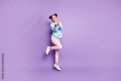 Full length body size view of nice attractive lovely slim dreamy cheery flirty romantic girl jumping sending air kiss isolated on violet purple lilac bright vivid shine vibrant color background