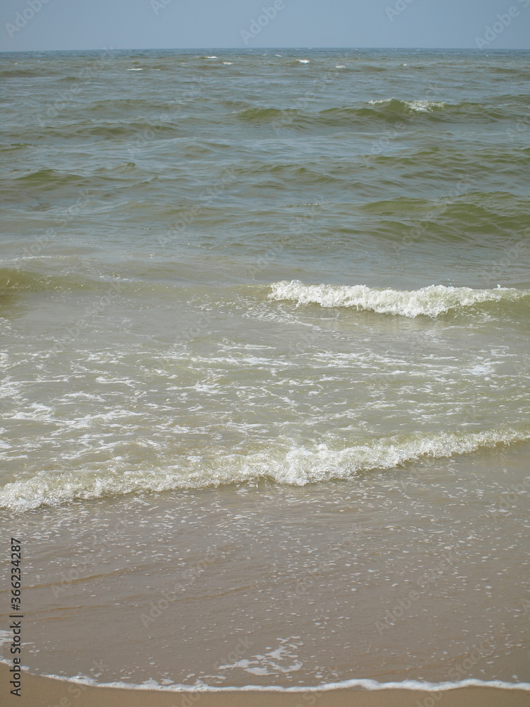 Calm waves at the beach of the north sea in Katwijk/NL