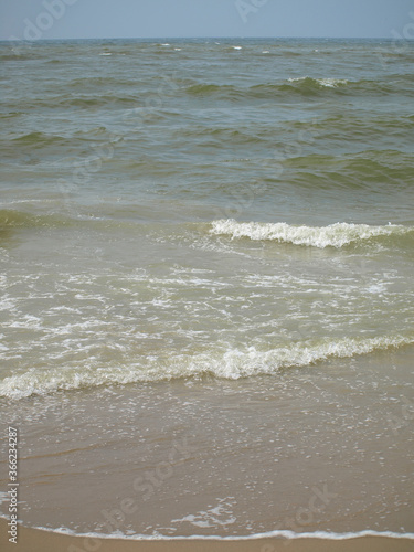 Calm waves at the beach of the north sea in Katwijk NL