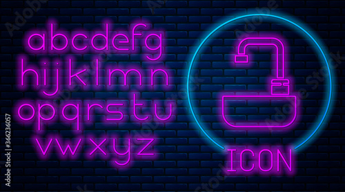 Glowing neon Washbasin with water tap icon isolated on brick wall background. Neon light alphabet. Vector Illustration.