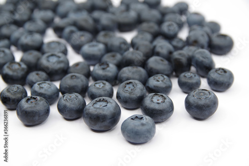 Blueberries isolated on a white background. Fresh blueberry wallpaper.