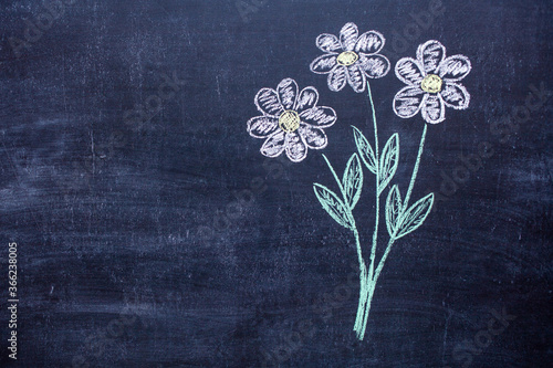 Drawing of a bouquet of flowers on a chalk Board