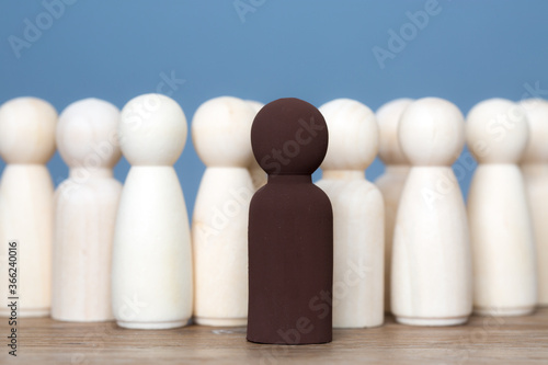 A black leader or manager standing out from the crowd