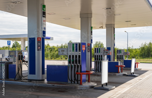 Gasoline and diesel distributor at the gas station. Gas pump nozzles. Petrol filling gun close-up at the gas station. Colorful Petrol pump filling nozzles. Fuel pump under the shed.
