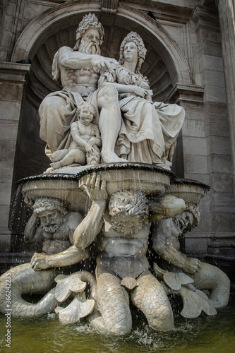 The Danubius fountain, Danubiusbrunnen at the Albertina Museum, Albertinaplatz in Vienna, Austria. photo