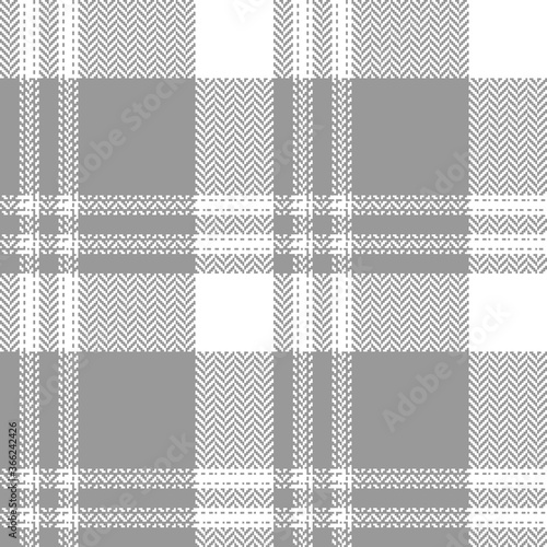 Plaid pattern vector in grey and white. Herringbone textured tartan check plaid graphic for flannel shirt, skirt, tablecloth, or other modern spring, autumn, winter textile print.