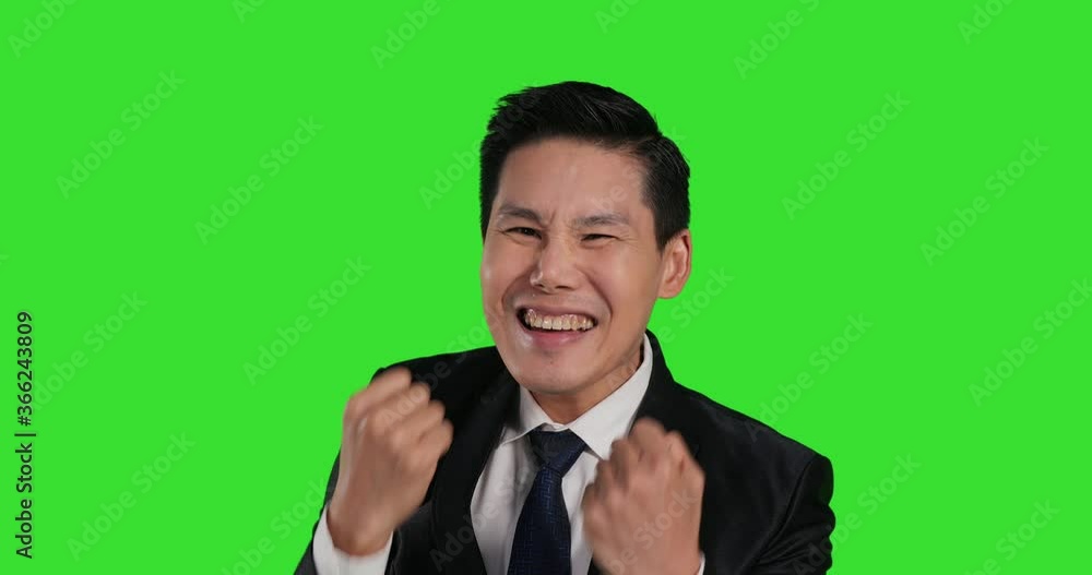 Portrait of asian businessman with success emotion at green screen background. Chroma key green screen background. Portrait of asian businessman with success emotion at green screen background. Chroma key green screen background.