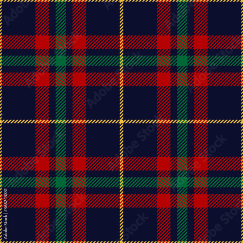 Christmas check textile pattern in red, green, blue, yellow. Seamless dark multicolored New Year plaid for skirt, flannel shirt, tablecloth, or other modern winter holiday textile print.