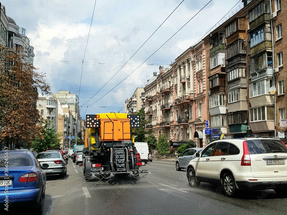 Disinfection of a street in the city during covid-19. Summer 2020. Stoana Ukraine, Kiev city. Disinfection of Saksaganskogo street - the central street of capitals