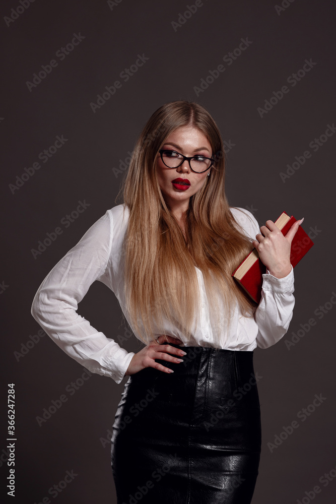 Fototapeta premium Woman teacher or business woman holding book.