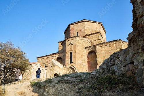 Old house built of yellow stones and bricks. Orthodox church in Jvari Monastery located near Mtskheta, Georgia.