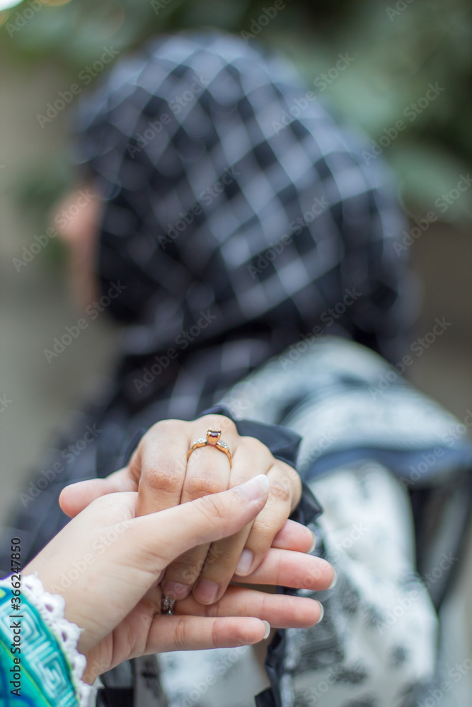 wearing ring on her hand