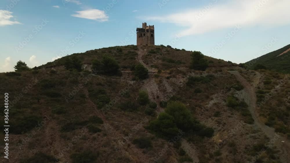 Aerial upward movement of hill with abandoned castle on the top Aerial upward movement of hill with abandoned castle on the top