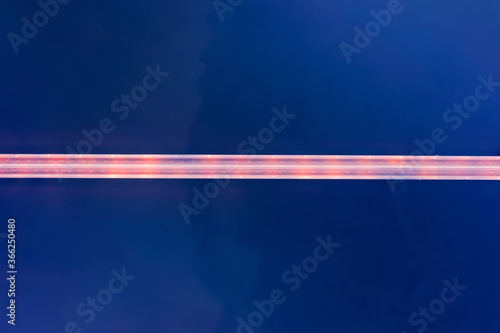 Illuminated long highway ro...