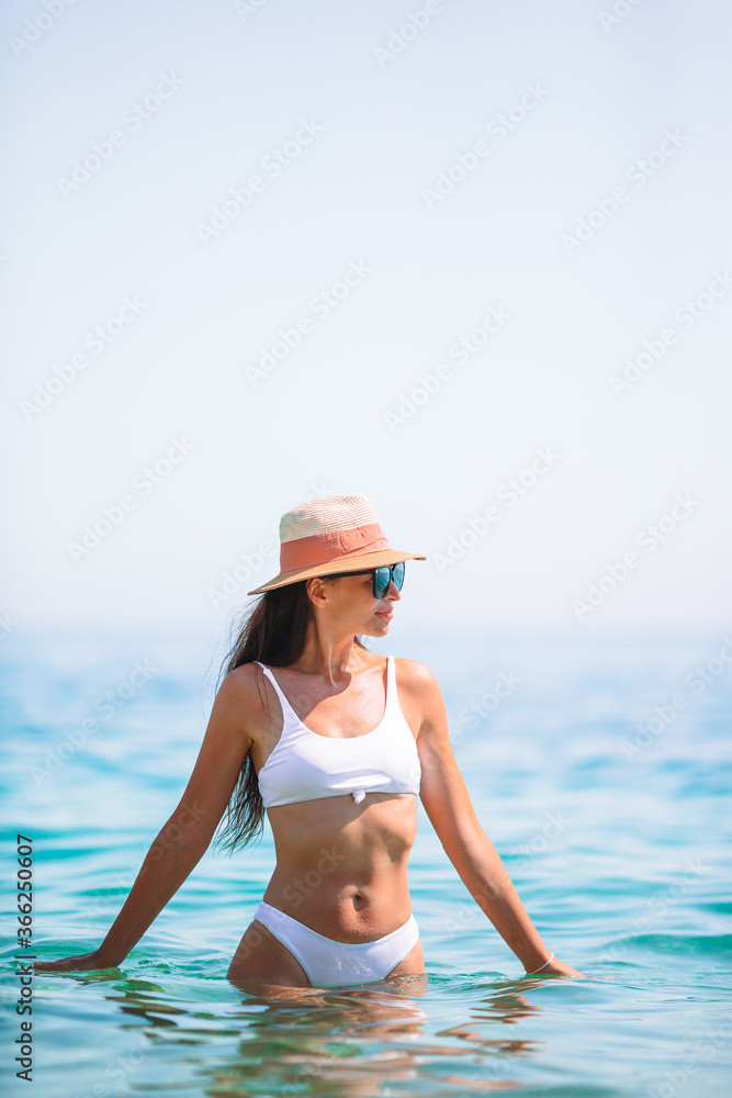 Happy girl background the blue sky and turquoise water in the sea Happy girl background the blue sky and turquoise water in the sea