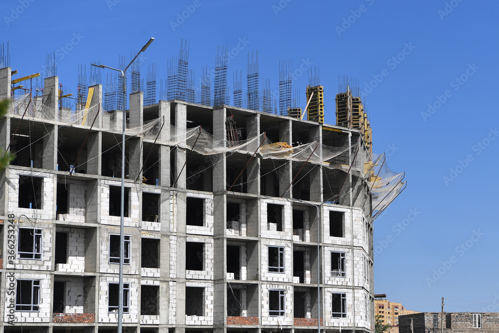 Fototapeta premium construction, crane, building, architecture, site, sky, house, development, build, industry, concrete, business, blue, cranes, work, tower, city, structure, new, buildings, apartment, urban, construct