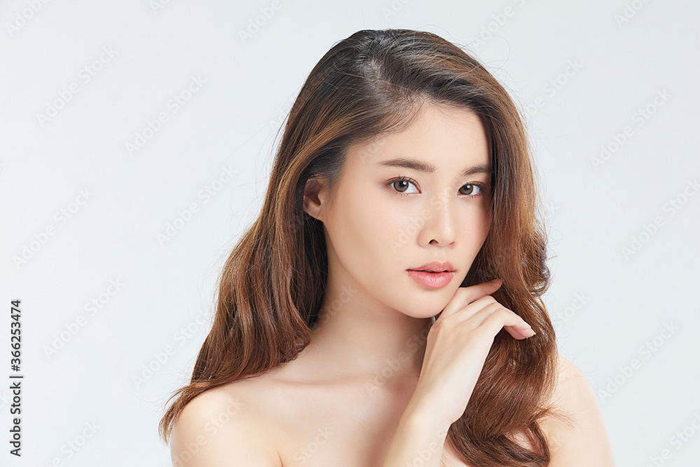 Beautiful Asian female model posing for beauty theme image isolated on white studio background Beautiful Asian female model posing for beauty theme image isolated on white studio background