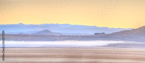 FOG ALONG THE LOWLANDS.  Winter view over farmland in the drakensberg foothills, Eastern Cape Elliot district, South Africa