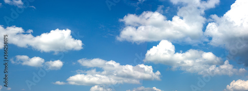 Wide banner with blue sky and white clouds. © Natasha 