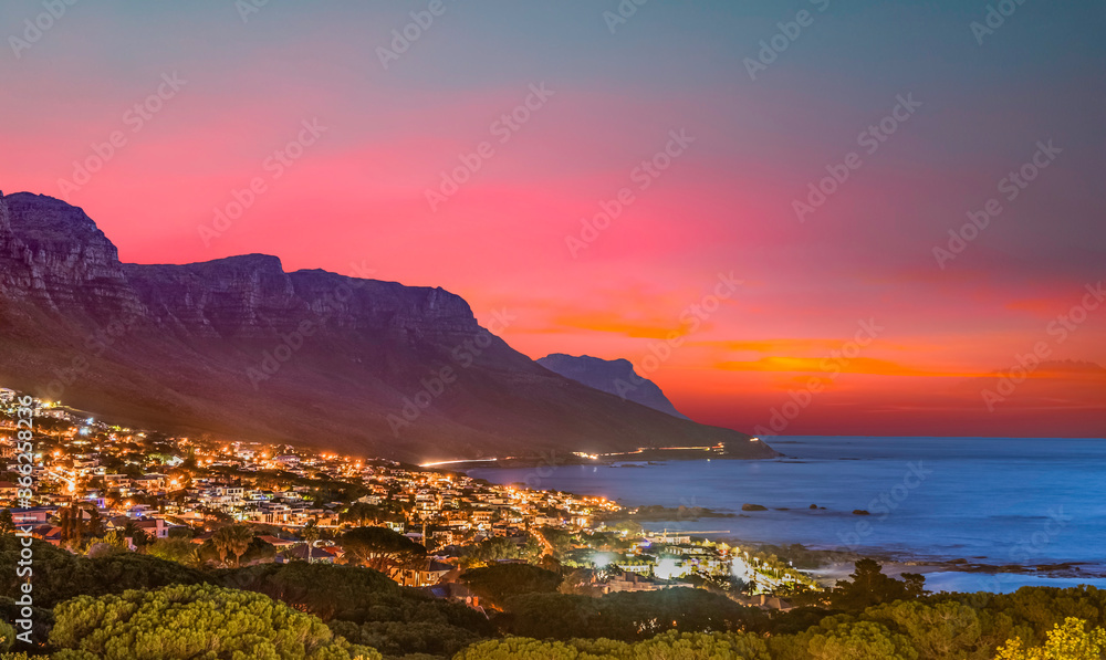 Camps bay illuminated at night with twilight sky in cape town south africa