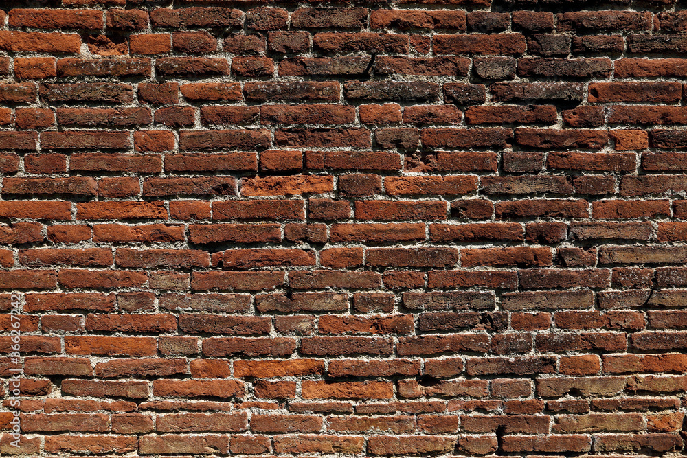 Fototapeta premium An ancient red brick wall 