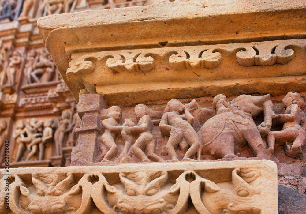 Khajuraho sculptures and paterned artifacts on the temple walls, India