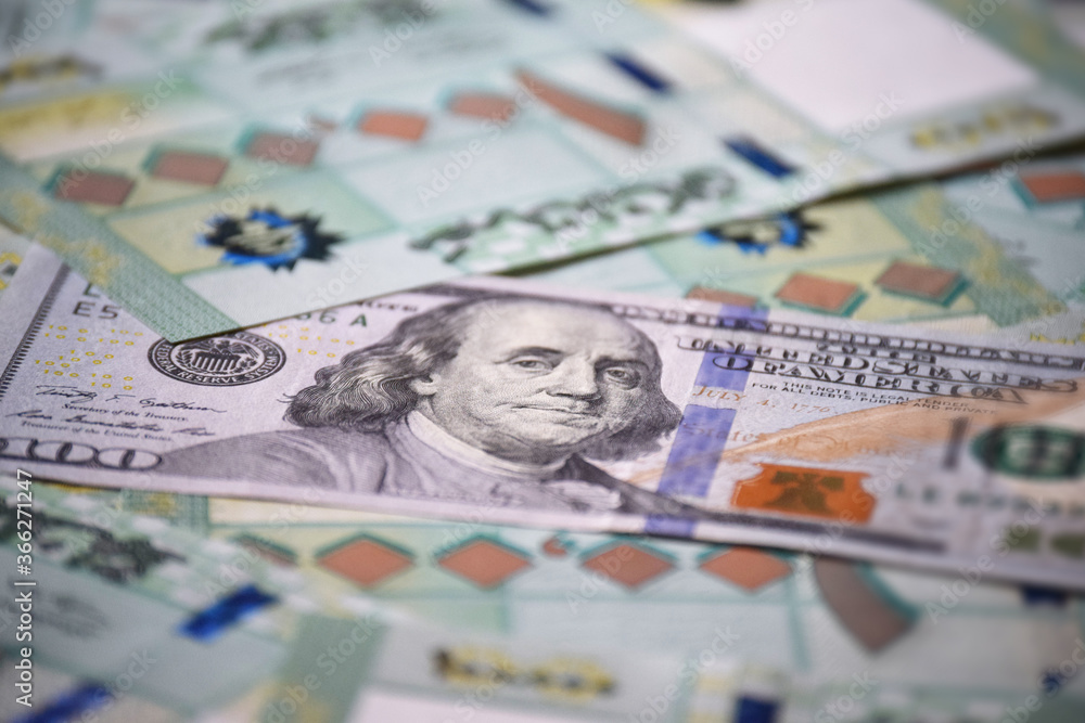 One hundred Lebanese lira one hundred dollar, economy, cash money, currency fading One hundred Lebanese lira one hundred dollar, economy, cash money, currency fading