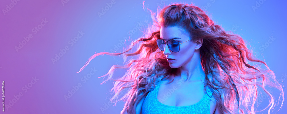 Fototapeta High Fashion. Woman in colorful neon light, make-up. Sexy girl, stylish hair, trendy makeup. Party disco pink blue neon style. Creative art beauty portrait, fashionable model face, make up