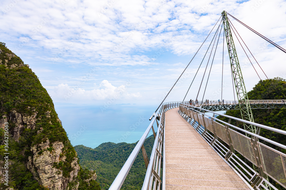 Obraz premium The sky bridge in the north of Langkawi, Malaysia. The landmark of the small Malaysian Island. One pillar and 12 cable holding the bridge over the valley. A breathtaking view over the Andaman Sea 