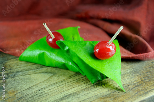 sweet paan wrapped in betel leaf, often used as an after dinner digestive.
