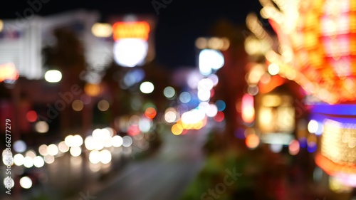 Defocused fabulous Las Vegas Strip boulevard, luxury casino and hotel, gambling area in Nevada, USA. Nightlife and traffic near Fremont street in tourist money playing resort. Neon lights of sin city