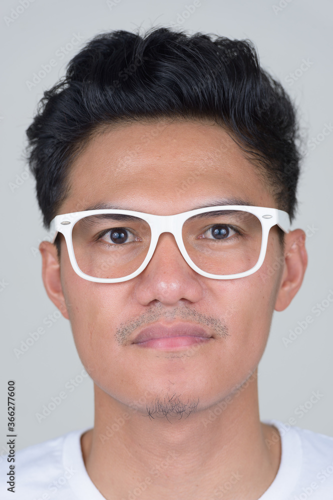 Face of handsome Asian nerd man with eyeglasses Face of handsome Asian nerd man with eyeglasses