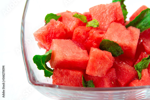 Watermelon salad with mint close-up on white background