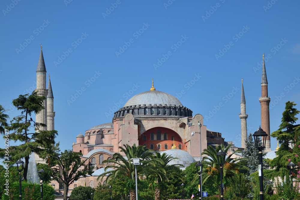 Naklejka premium Hagia Sophia (Aya Sophia), Christian greek-orthodox patriarchal basilica, imperial mosque and museum, Istanbul, Turkey - south side. The world famous monument of Byzantine architecture