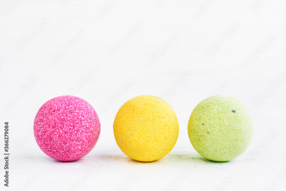 Three colorful bath bombs on white background. Copy space Three colorful bath bombs on white background. Copy space