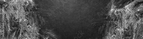 Panel kuchenny z motywem Black stone background, dark grey cement texture with flour. Layout with free text space. Backdrop for cooking food. Top view, flat lay, wide composition