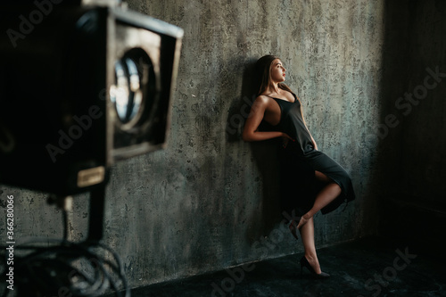 Portrait of caucasian brunette woman and camera