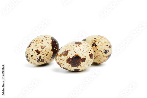 round raw quail eggs isolated on white background