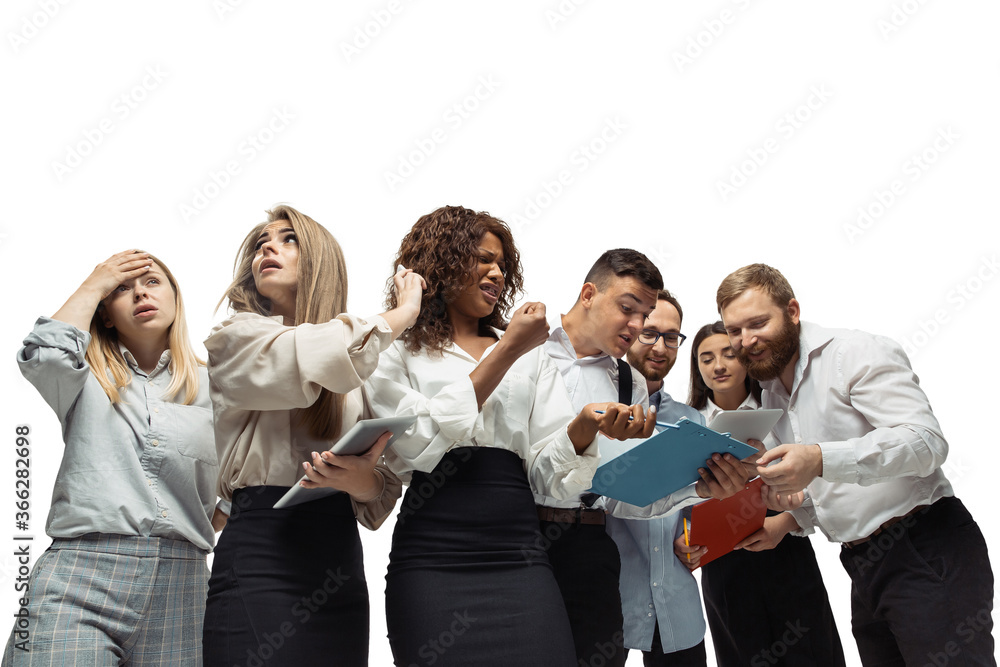 Shocked. Nervous tensioned investors analyzing crisis stock market with charts on their gadgets. Defaulted, crisis of exchange markets and funds. Overly concerned men and women with gadgets, papers. Shocked. Nervous tensioned investors analyzing crisis stock market with charts on their gadgets. Defaulted, crisis of exchange markets and funds. Overly concerned men and women with gadgets, papers.