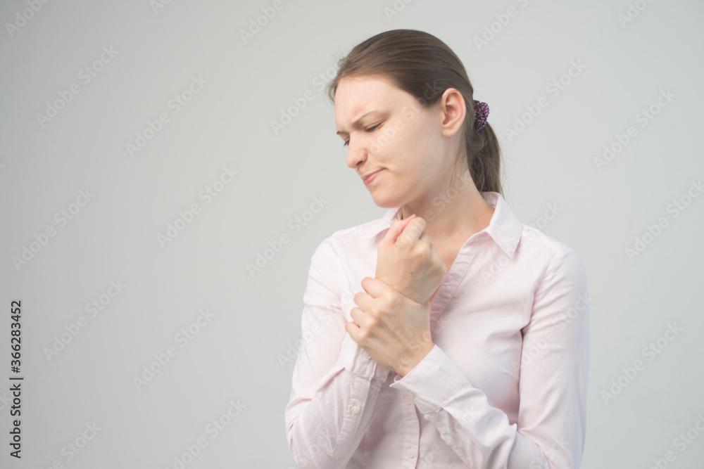 Tired woman feeling pain, massaging tense muscles Tired woman feeling pain, massaging tense muscles