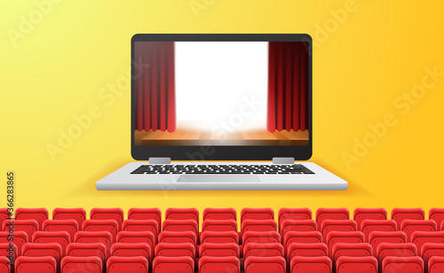 online cinema, video and film streaming with device at home concept. red curtain stage show on the laptop screen with empty red seats