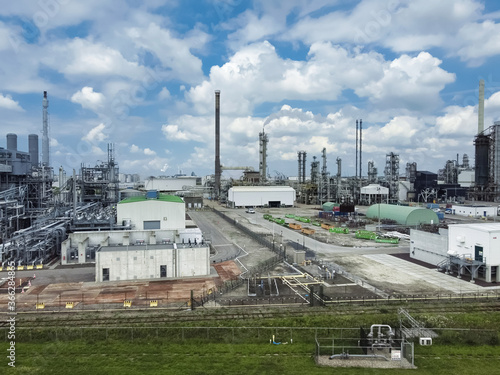 industrial area dominated by chimneys and smoke of the oil refinery, Rotterdam