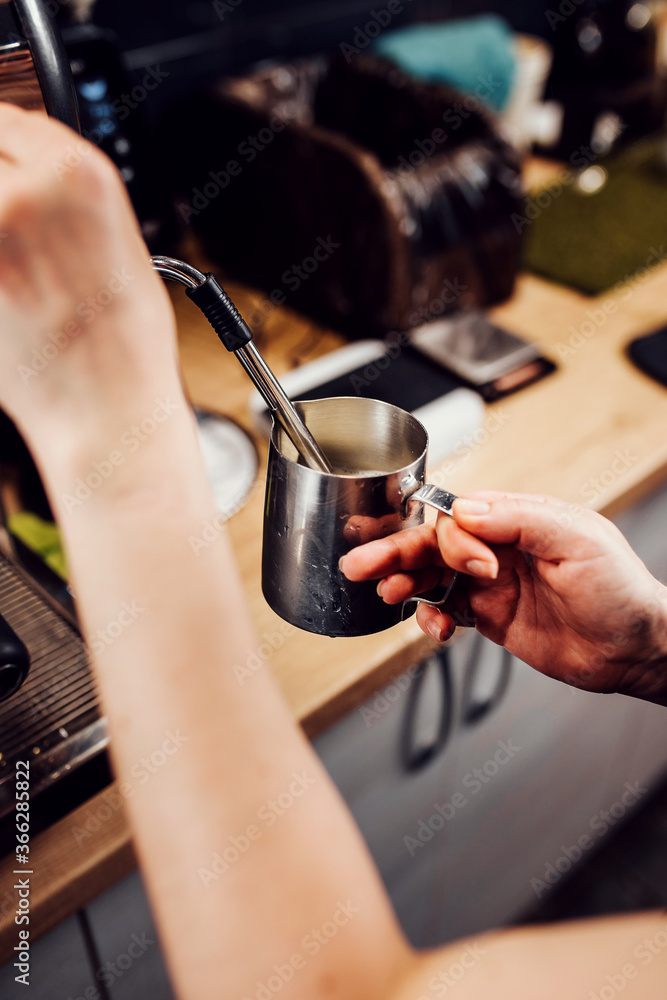 Barista hands during work - professional coffee brewing - the art of bartender