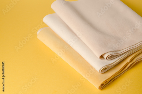 Bright yellow and white velour textile samples. Fabric texture background photo