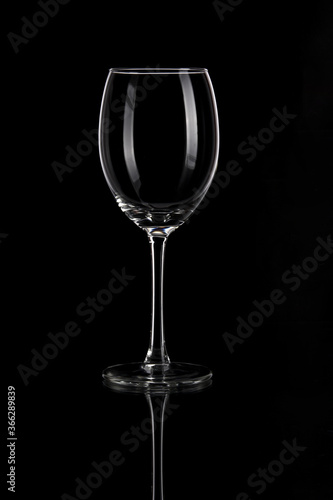 Empty wine glass on black background