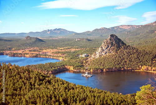 Majestic nature of Kazakhstan concept: epic view of Burabay lake with Zhumbaktas rock at sunrise in autumn season